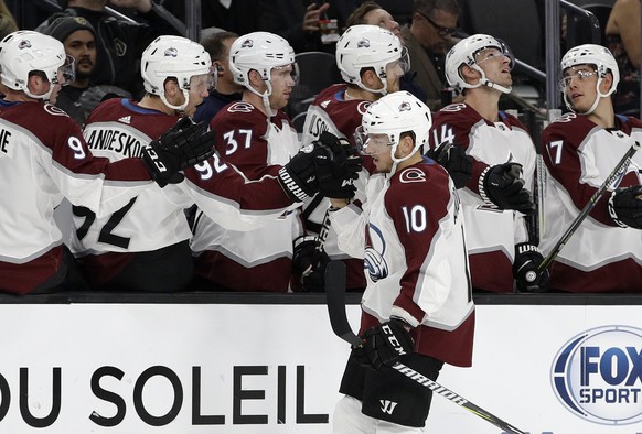 Colorado Avalanche&#039;s Sven Andrighetto (10) celebrates with teammates after scoring against the Vegas Golden Knights during the first period of an NHL preseason hockey game Thursday, Sept. 28, 201 ...