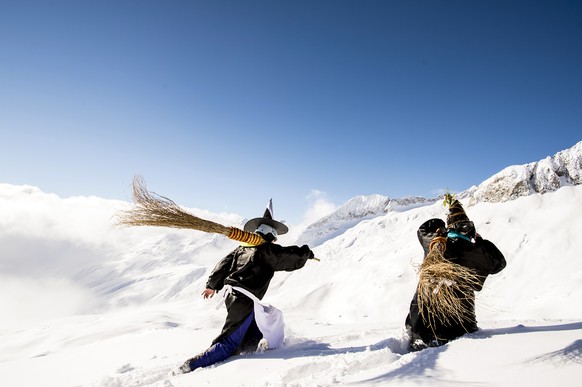 Skiers disguised as a witch participate in the 34rd ski downhill race at Belalp-Blatten, Southwestern Switzerland, Saturday, January 16, 2016. The downhill at Belalp is a fun event called &quot;Hexena ...