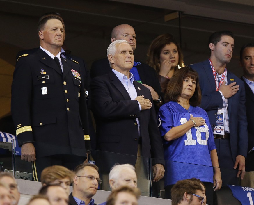 Vice President Mike Pence, front center, stands during the playing of the national anthem before an NFL football game between the Indianapolis Colts and the San Francisco 49ers, Sunday, Oct. 8, 2017,  ...
