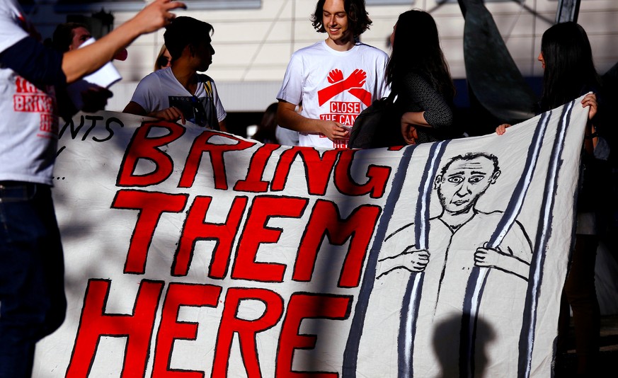 Refugee advocates hold a banner during a protest in central Sydney, Australia, October 5, 2016 calling for the closure of the Australian detention centres in Nauru and Manus Island. REUTERS/David Gray ...