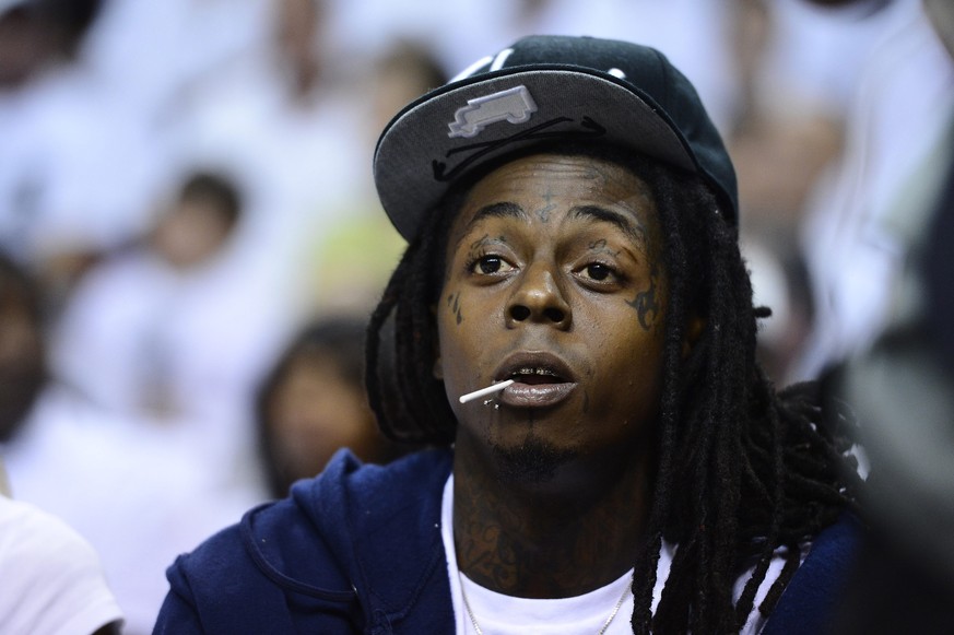 epa04657979 (FILE) The file picture dated 19 June 2012 shows US rapper Lil Wayne watching the Miami Heat against the Oklahoma City Thunder in game four of the NBA Finals at the American Airlines Arena ...