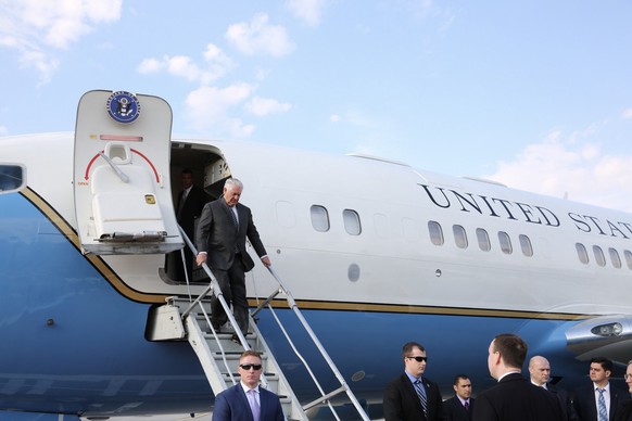 epa05903099 A handout photo made available by the US Department of State shows US Secretary of State Rex Tillerson (top) disembarking his plane as he arrives at the Vnukovo airport, in Moscow, Russia, ...