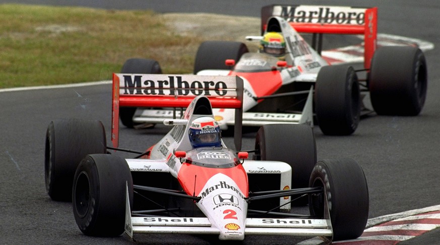 FILE - In this Oct. 22, 1989 file photo, French McLaren-Honda driver Alain Prost is chased by Brazilian teammate Ayrton Senna during the Japanese Formula One Grand Prix at Suzuka Circuit in Suzuka, ce ...