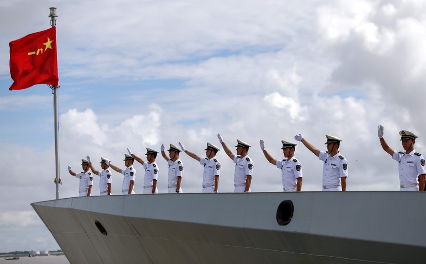 epa05569692 Chinese Navy officers wave hands from deck of Chinese Navy frigate &#039;FFG Xiangtan&#039; as they departs Myanmar International Terminals at the Thilawa port of Yangon, Myanmar, 04 Octob ...