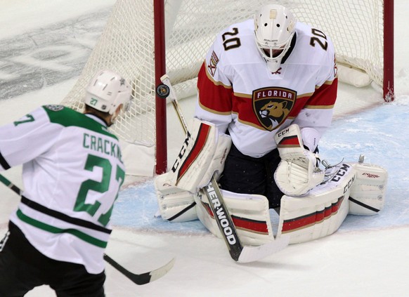 Dallas Stars&#039; Adam Cracknell, left, shoots the puck on Florida Panthers&#039; goalie Reto Berra during NHL hockey preseason action in London, Ontario, Sunday, Oct. 2, 2016. (Dave Chidley/The Cana ...