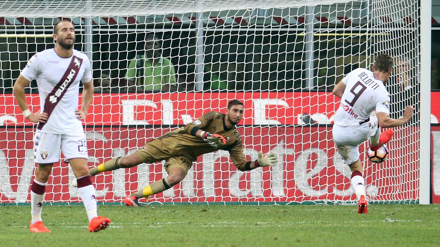 epa05505421 Milan&#039;s goalkeeper Gianluigi Donnarumma saves the penalty kicked by Torino&#039;s Andrea Belotti (R) during the Italian Serie A soccer match AC Milan vs Torino FC at Giuseppe Meazza s ...