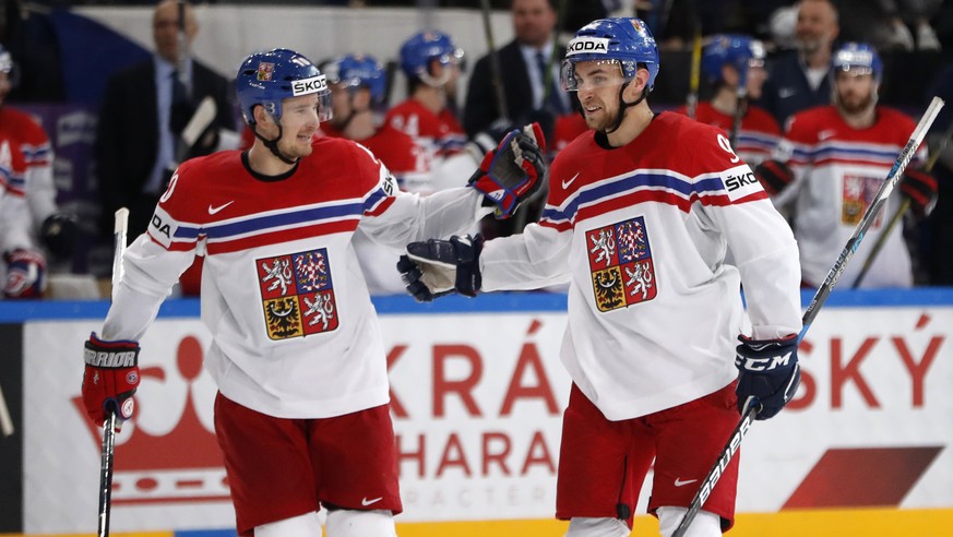 Czech Republic&#039;s Jan Rutta, right, celebrates after scoring his sides third goal with teammate Roman Cervenka, left, during the Ice Hockey World Championships group B match between France and Cze ...