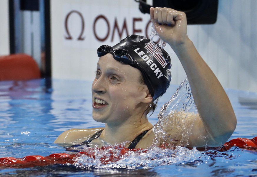 Unites States&#039; Katie Ledecky celebrates after winning gold in the women&#039;s 800-meter freestyle final during the swimming competitions at the 2016 Summer Olympics, Friday, Aug. 12, 2016, in Ri ...