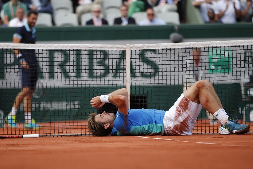 Switzerland&#039;s Stan Wawrinka lays on the clays as he plays Croatia&#039;s Marin Cilic during their quarterfinal match of the French Open tennis tournament at the Roland Garros stadium, Wednesday,  ...