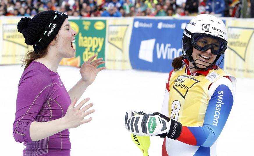Michelle Gisin, left, congratulates teammate Wendy Holdener, of Switzerland, at finish area after taking second place in an alpine ski, women&#039;s World Cup slalom, in Ofterschwang , Germany, Sunday ...