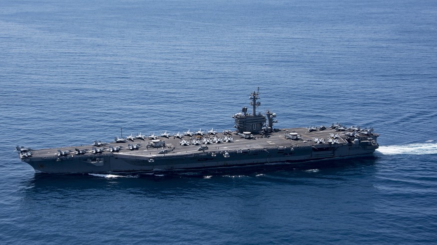 epa05913061 A handout photo made available by the US Department of Defense shows the aircraft carrier USS Carl Vinson (CVN 70) in the Indian Ocean, 15 April 2017 (issued 18 April 2017). According to m ...