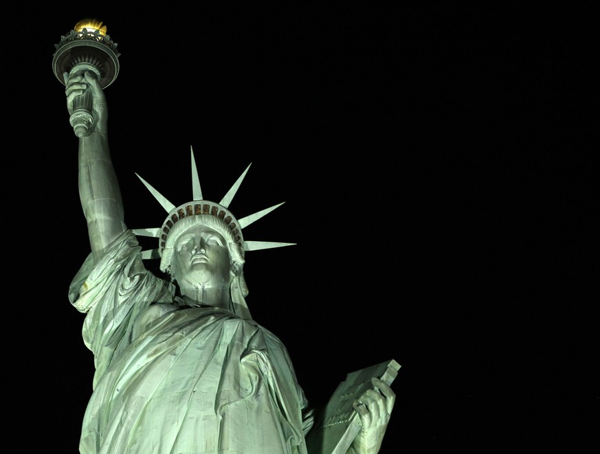 New light-emitting diodes or LEDs illuminate the Statue of Liberty on Liberty Island after the new system was turned on in New York, Tuesday, July 7, 2015. The system comes from Musco Lighting of Oska ...