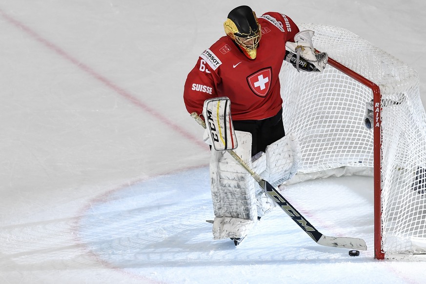 Switzerland’s goaltender Leonardo Genoni reaacts after the third goal during their Ice Hockey World Championship group B preliminary round match between Switzerland and Finland in Paris, France on Sun ...