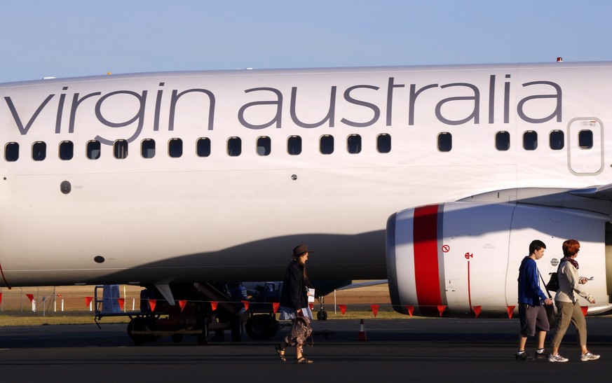 epa04103377 A picture made available 28 February 2014 shows passengers boarding a Virgin Australia plane at Hobart International Airport, in Hobart, Tasmania, Australia, 12 January 2014. Virgin Austra ...