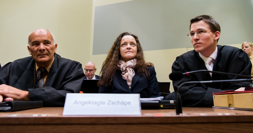 MUNICH, GERMANY - DECEMBER 9: Beate Zschaepe, the main defendant in the NSU neo-Nazi murder trial (C) and her lawyers Mathias Grasel (R) and Hermann Borchert (L) wait for day 249 of the trial at the O ...