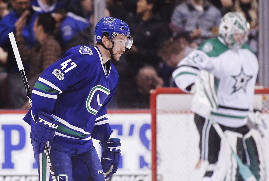 Vancouver Canucks&#039; Sven Baertschi (47) skates by Dallas Stars goalie Kari Lehtonen (32) after scoring a goal during the first period of an NHL hockey game Thursday, March 16, 2017, in Vancouver,  ...