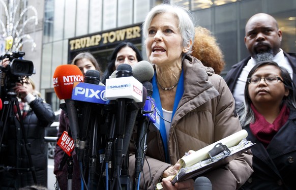 epa05661143 US Green Party presidential candidate Jill Stein (C) speaks during a press conference about the ongoing efforts she is involved in to recount votes in Michigan, Wisconsin and Pennsylvania  ...