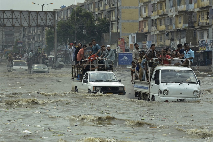 Pakistani commuters travel on a flooded street following a heavy rainfall in Karachi, Pakistan, Thursday, Aug. 31, 2017. Monsoon rains in Pakistan&#039;s port city of Karachi left at least eight peopl ...