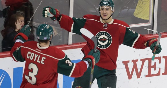 Minnesota Wild’s Charlie Coyle, left, congratulates Nino Niederreiter on his third goal of an NHL hockey game against the Buffalo Sabres, during the third period Thursday, Nov. 13, 2014, in St. Paul,  ...