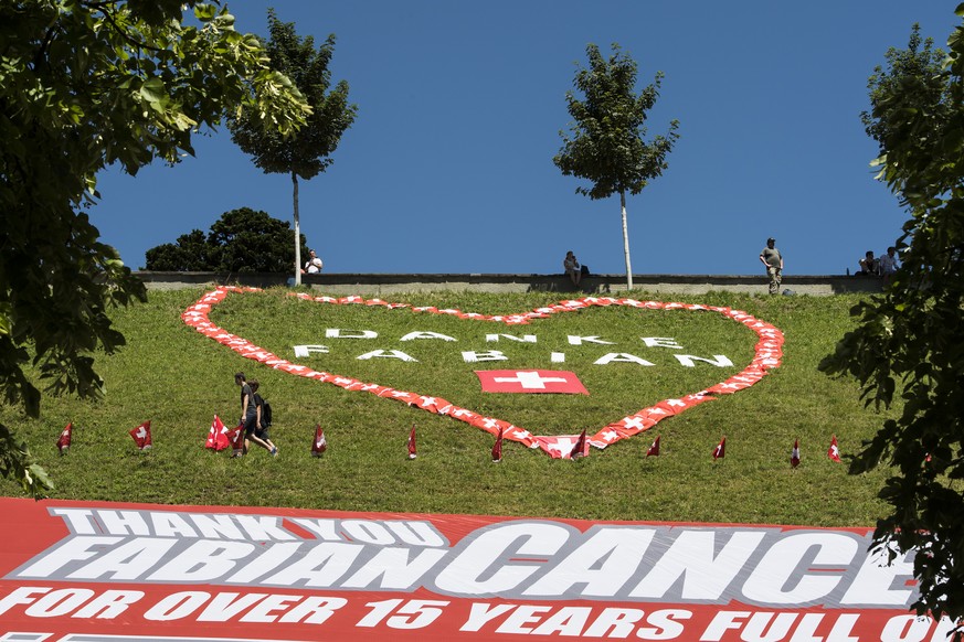 A giant banner in honor of Swiss rider Fabian Cancellara of team Trek Factory Racing is pictured during the 16th stage of the 103rd edition of the Tour de France cycling race over 209km between Moiran ...