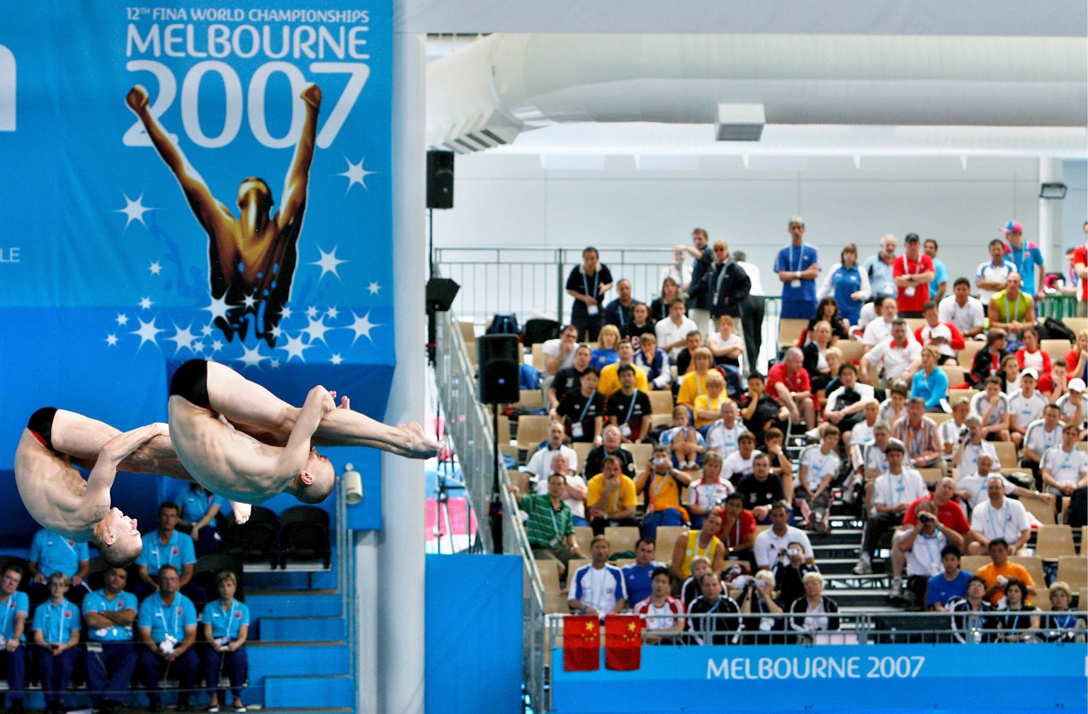 epa00960582 Russian divers Aleksandr Dobroskok and Gleb Galperin compete in the Men&#039;s 3m Synchronised Springboard preliminary round at the FINA Swimming World Championships in Melbourne, Australi ...