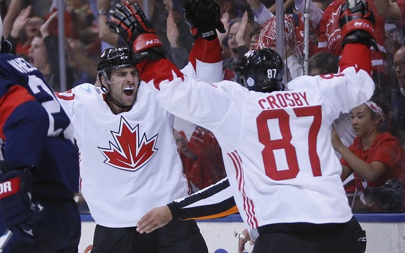 Sep 20, 2016; Toronto, Ontario, Canada; Team Canada forward John Tavares (20) and forward Sidney Crosby (87) celebrate a goal by forward Patrice Bergeron (not pictured) on Team USA during the second p ...