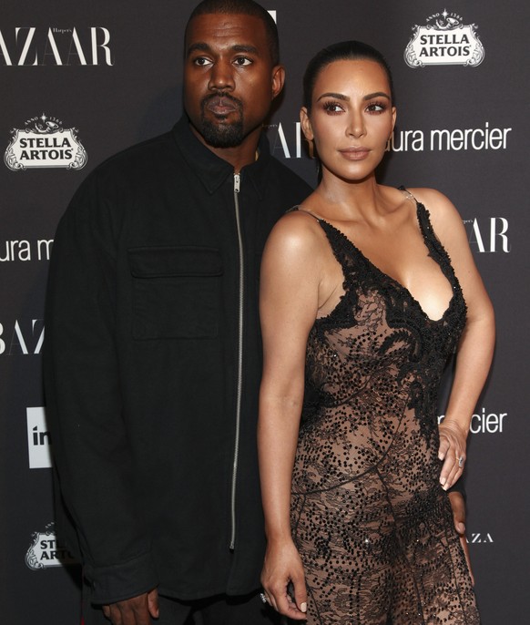 Recording artist Kanye West, left, and television personality Kim Kardashian, right, attend Harper&#039;s Bazaar Icons celebration during NYFW Spring/Summer 2017 at the Plaza Hotel on Friday, Sept. 9, ...