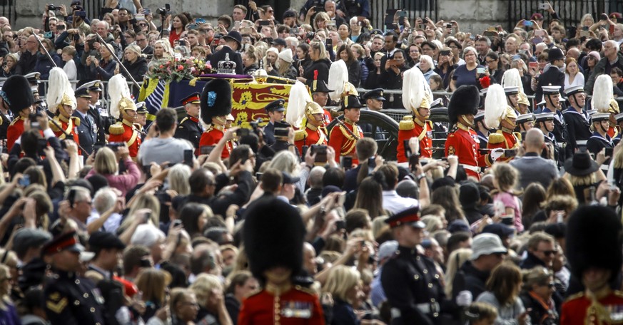 epa10193428 The coffin of Britain&#039;s Queen Elizabeth II is carried from Westminster Abbey as it begins its journey to Windsor Castle, during the State Funeral Procession in London, Britain, 19 Sep ...