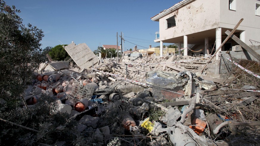 epa06149117 General view of the debris of a house after it collapsed last night due to a gas leak explosion in the village of Alcanar, Catalonia, northeastern Spain, 17 August 2017. Some media are rep ...