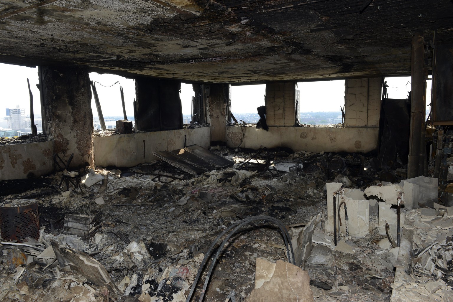 epa06036317 An undated handout photo made available by Britain&#039;s London Metropolitan Police Service (MPS) on 18 June 2017 shows a view on a burned flat inside the Grenfell Tower, a 24-storey apar ...