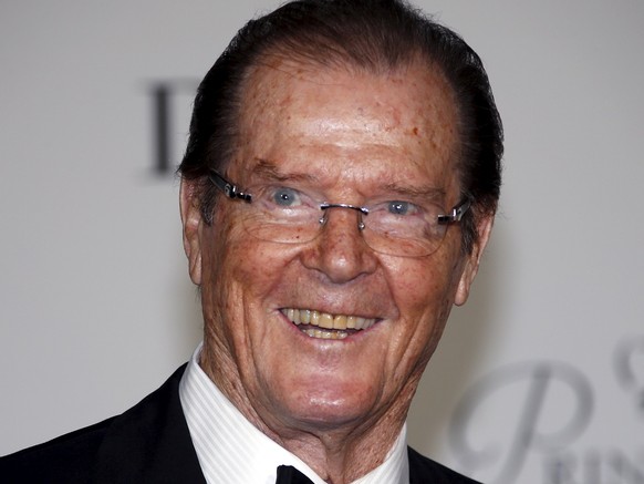 British actor Roger Moore and his wife Kristina Tholstrup arrive at the Princess Grace Awards gala in Monaco September 5, 2015. The Princess Grace Foundation-USA is a non-profit foundation dedicated t ...
