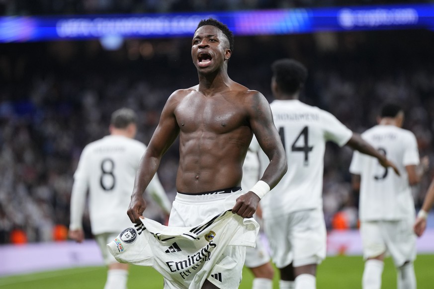 Nachrichten Linkding Real Madrid's Vinicius Junior celebrates after scoring his side's fourth goal during the Champions League opening phase soccer match between Real Madrid and Borussia Dortmund at the Santiago ...
