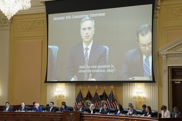 Former White House counsel Pat Cipollone is seen on a video screen as the House select committee investigating the Jan. 6 attack on the U.S. Capitol holds a hearing at the Capitol in Washington, Tuesd ...