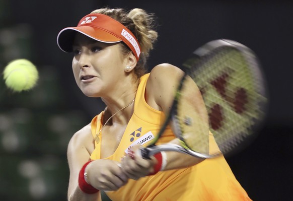 Belinda Bencic, of Switzerland, returns a shot against Caroline Wozniacki, of Denmark, during the women&#039;s singles match at the Pan Pacific Open women&#039;s tennis tournament in Tokyo, Tuesday, S ...