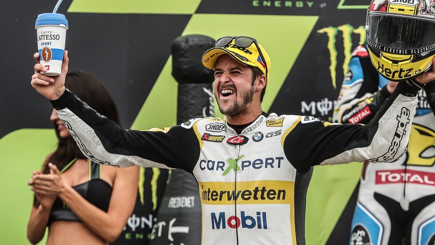 epa06128080 Swiss Moto2 rider Thomas Luethi of the CarXpert Interwetten team celebrates on the podium after winning the Moto2 race of the Motorcycling Grand Prix of the Czech Republic at Masaryk circu ...