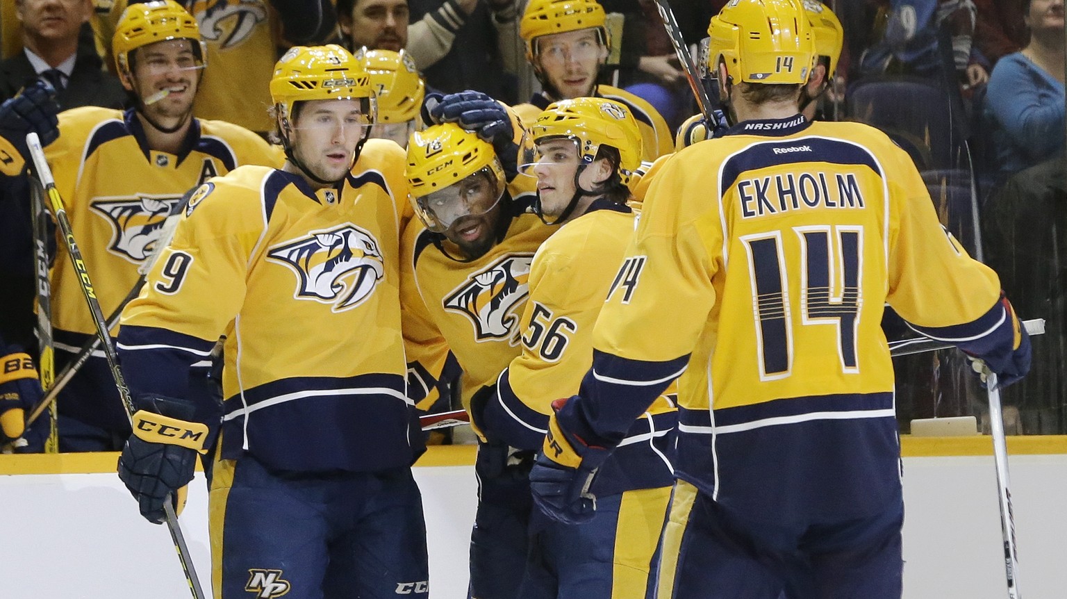 Nashville Predators defenseman P.K. Subban (76), center, celebrates with Filip Forsberg (9), of Sweden, Kevin Fiala (56), of Switzerland, and Mattias Ekholm (14), of Sweden, after Subban scored a goal ...