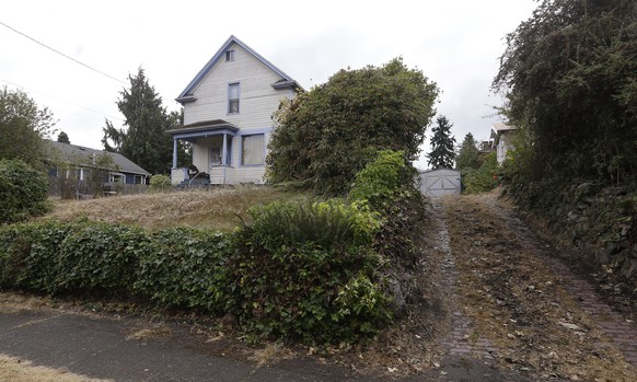 The home shared by three elderly brothers facing child pornography charges stands empty, Thursday, Aug. 31, 2017, in Seattle. The men, 82-year-old Charles Emery, 80-year-old Thomas Emery and 78-year-o ...