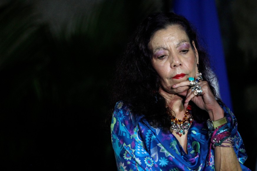 Nicaragua&#039;s first lady and vice presidential candidate Rosario Murillo stands next to her husband Daniel Ortega (not pictured), current president and presidential candidate from the ruling Sandin ...