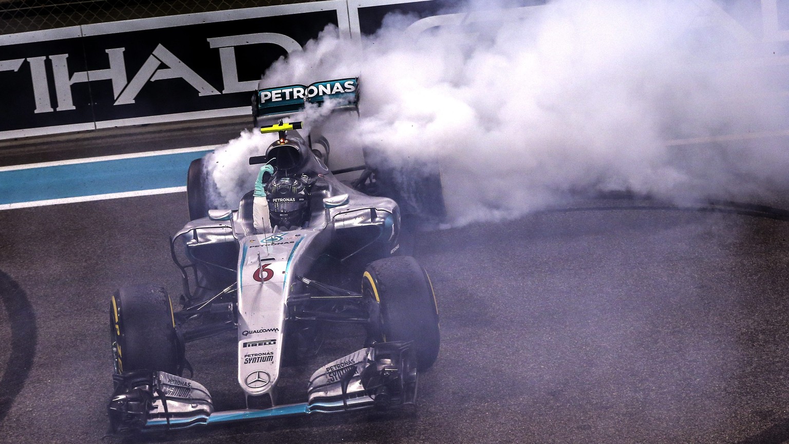 epa05649703 German Formula One driver Nico Rosberg of Mercedes AMG GP celebrates winning the Formula One World Championship 2016 after his second place in the Abu Dhabi Formula One Grand Prix at Yas M ...