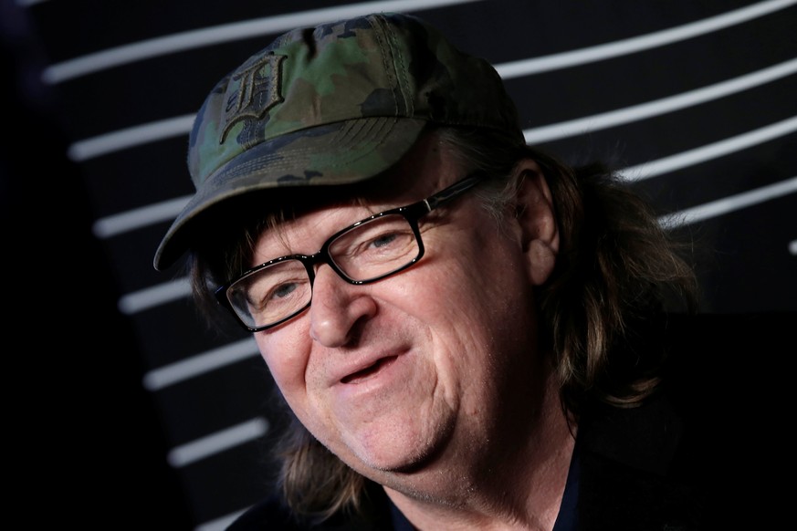 Filmmaker Michael Moore poses as he arrives for the 20th Annual Webby Awards in Manhattan, New York, U.S., May 16, 2016. REUTERS/Mike Segar