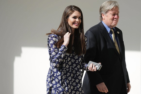 epa06147243 (FILE) - White House then Director of Strategic Communications Hope Hicks (L) and Senior Counselor to the President and White House Chief Strategist Steve Bannon (R) walk down the West Win ...