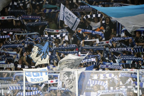 Ambri`s fans in the stands (curva sud) celebrating the victory after the preliminary round game of the National League A (NLA) Swiss Championship 2014/15 between HC Ambri Piotta and HC Lugano, at the  ...