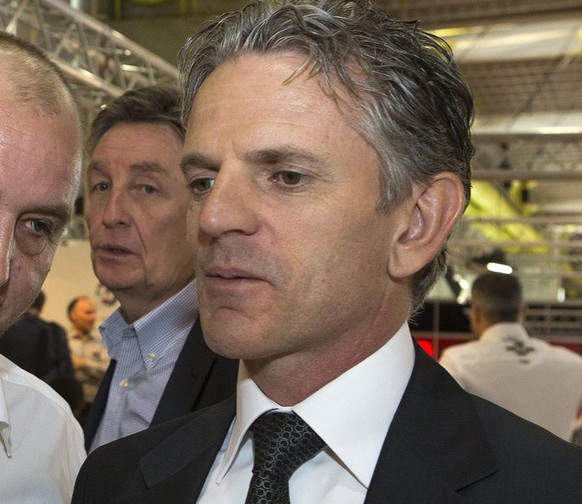 Fred Corminboeuf, left, team manager of TECHNOMAG-Carxpert team, speaks with the main team sponsor of the TECHNOMAG-Carxpert team Olivier Metraux, right, at the presentation of the TECHNOMAG-Carxpert  ...