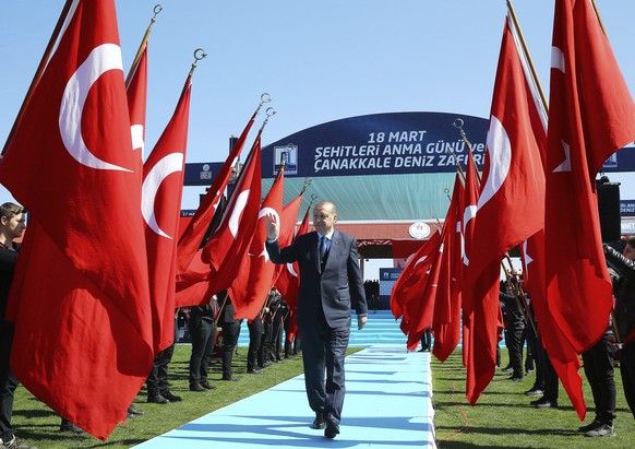 Turkey&#039;s President Recep Tayyip Erdogan salutes as he arrives to attend a ceremony marking the 102nd anniversary of Gallipoli campaign, in the Aegean port of Canakkale, near Gallipoli where troop ...