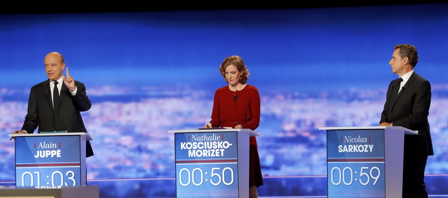 French politician Alain Juppe (L) speaks as Nathalie Kosciusko-Morizet (C) and Nicolas Sarkozy listen during the first prime-time televised debate for the French conservative presidential primary in L ...