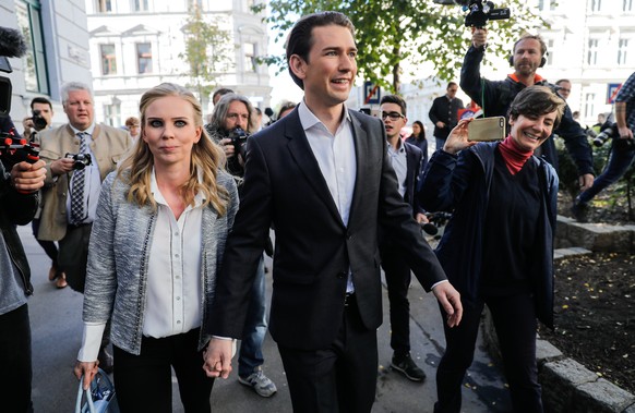 epa06266926 Austrian Foreign Minister Sebastian Kurz (R), the leader and top candidate of the Austrian Peoples Party (OeVP) and his girlfriend Susanne Thier (L) arrive at a polling station during the  ...