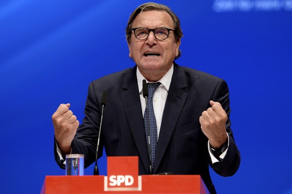 epa06049209 Former German chancellor Gerhard Schroeder delivers a speech during the extraordinary federal party conference of the German Social Democratic Party (SPD) at the Westfalenhalle in Dortmund ...