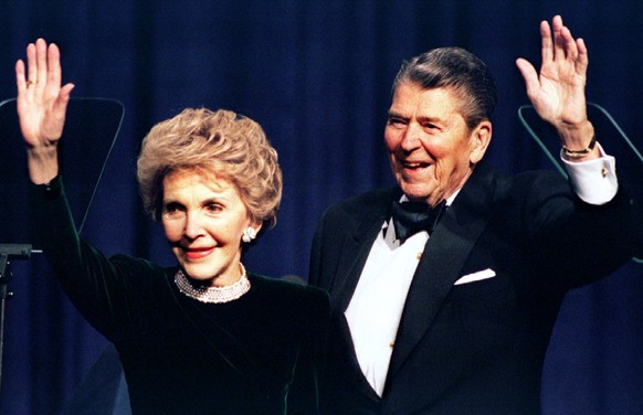 Former US President Ronald Reagan and his wife Nancy wave while attending a gala celebrating his 83rd birthday, in Washington February 3, 1994. REUTERS/Mike Theiler
