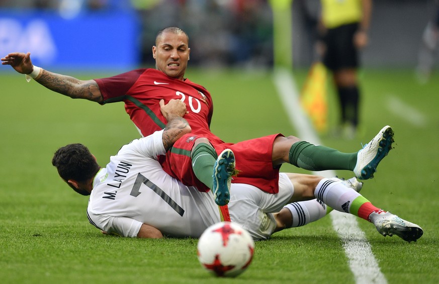 Portugal&#039;s Ricardo Quaresma is tackled by Mexico&#039;s Miguel Layun, left, during the Confederations Cup, Group A soccer match between Portugal and Mexico, at the Kazan Arena, Russia, Sunday, Ju ...