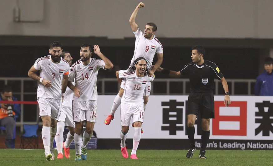 Football Soccer - China v Syria - 2018 World Cup Qualifying Asia Zone - Round 3 Group A - Xi&#039;an, China - 6/10/16 Syria&#039;s Mahmoud Al Mawas and team mates celebrate after scoring the first goa ...